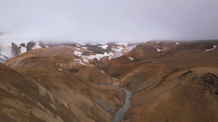 Kerlingarfjoll is a group of small, geothermically active, rust-colored mountains capped with snow, in Iceland's central highlands.