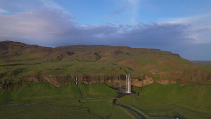 The Seljalandsfoss waterfall on the south coast of Iceland bathed in the otherworldly light of the...