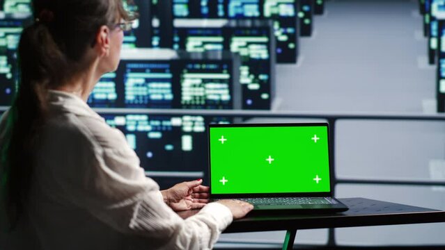 Proficient system administrator in server farm housing high end rackmounts capable of quickly and efficiently performing complex computations and data analysis, using mockup laptop to prevent crashes