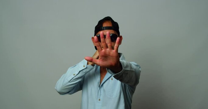 A middle-aged man dances and sings wildly in the studio