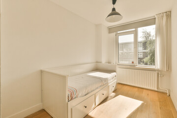a bedroom with white walls and hardwood flooring in the room, there is a small bed on the right side