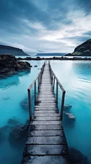 Fotobehang wooden pier on a blue crystal clear nordic lake © medienvirus
