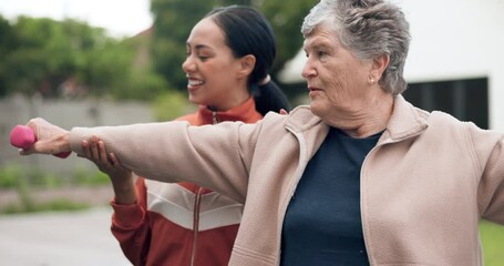 Fitness, retirement and coach with a senior woman outdoor for a dumbbell workout for health or mobility. Exercise, physiotherapy or rehabilitation with a personal trainer and elderly client training