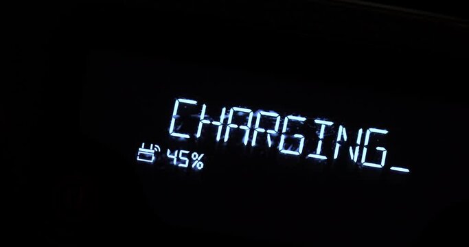 Battery charging symbol glowing close up