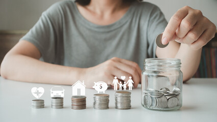 Close-up of hand young woman, a female putting a coin into a piggybank to save cost, financial plans to spend enough money income for saving money and payment, finance people, save money, management.