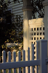 white picket fence gate at night