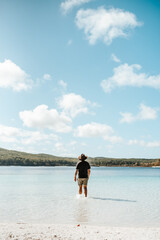 Fototapeta na wymiar Man standing in a lake