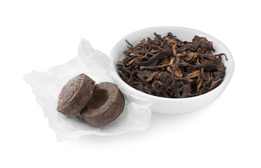 Cake shaped traditional Chinese pu-erh tea and leaves isolated on white
