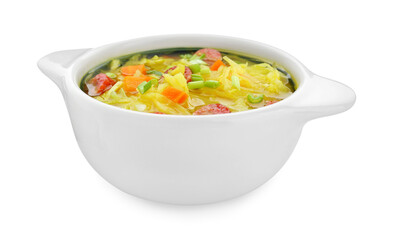 Bowl of delicious sauerkraut soup with smoked sausages and green onion isolated on white