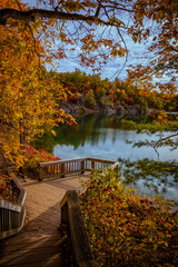 View of staircase during autumn, Fall foliage around Pink Lake in Gatineau Park, Quebec, Canada. Photo taken in October 2022.