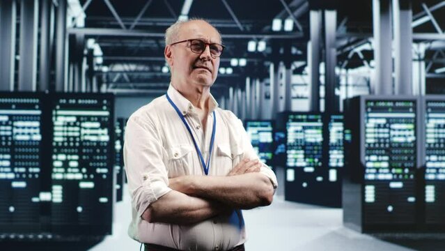 Portrait of elderly engineer looking around modern server room in data center, preparing to start comission on malfunctioning high tech facility hardware rigs in order to ensure errorless operations