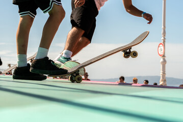 people practice skateboard in skate park. action sports, man at skate board championship, unrecognizable skater. © Xan Gasalla