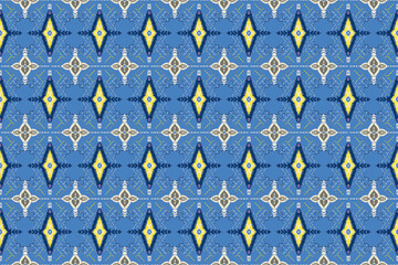 Ikat embroidery on green background.