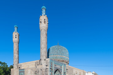 Historical mosque of St. Petersburg. Minarets against the blue sky.