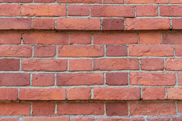 Brick texture close-up. Background of red bricks.