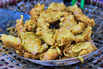 Freshly fried tofu on a tray, a very popular tasty Indonesian snacks, called Tahu Goreng