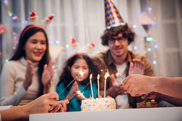 Happy family celebrating birthday together at home	