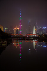Fototapeta na wymiar Shanghai Cityscape: Illuminated Skyscrapers Reflecting on Water