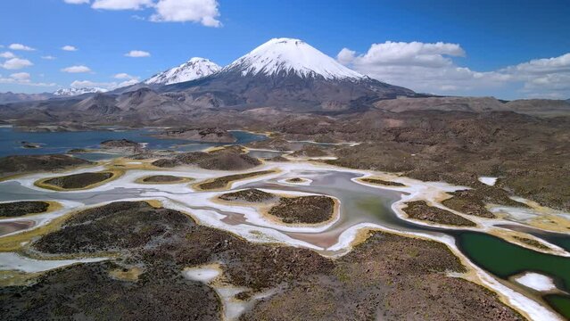 Aerial view over of Cotacotani Lagoon, Lauca National Park in Chile - rising, drone shot