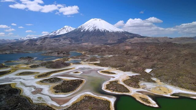 Aerial view over of Cotacotani Lagoon, Lauca National Park in Chile - forward eye bird, drone shot