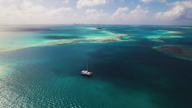 Blue clear waters. Isolated boat. Sand keys Boca Del Medio, Los Roques, Venezuela