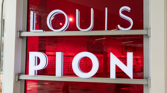 louis pion logo brand chain and text sign front of store facade windows commercial street fashion shop jewelry boutique