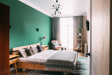 Modern Bright Bedroom's In Scandinavian Stylish. Family Apartment With Bright Green Wall And Wooden Designed Bed. Idea For Home Design. Light Colors Of Design. Stylish Apartment Interior Of Bedroom's.