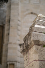 Detail of a stone column from the exterior wall of an old church in Jerusalem.