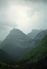 Vertical film photo of mountains in rain