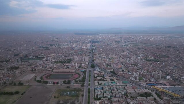 Aerial view of avenue amidst of the city at sunset