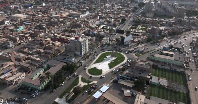 Aerial shot of traffic in the city at sunset.
