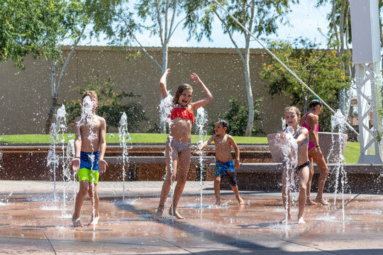 Children playing in water on splashpad