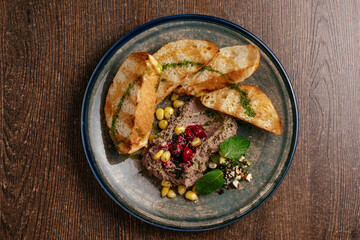 goose liver pate with croutons on a plate