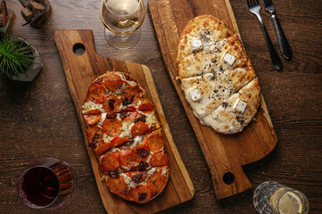 italian pizzetta with sausage on a wooden board. Restaurant menu