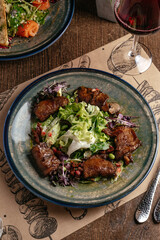 steak salad with vegetables, herbs 