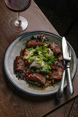 steak salad with vegetables, herbs 