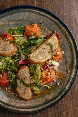 salad with salmon and croutons