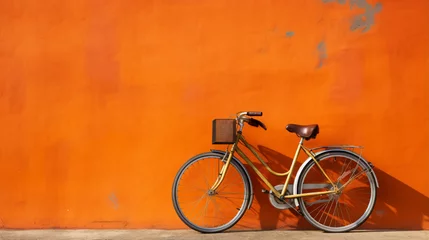 Fototapete Fahrrad Orange color city bike against the wall