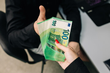 Business woman holding euro banknote money. Euro banknote money group isolated. Money exchange, cash, finance, money background, euro currency and pay for work.