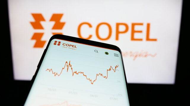 Stuttgart, Germany - 08-14-2023: Mobile phone with website of company Companhia Paranaense de Energia (Copel) on screen in front of logo. Focus on top-left of phone display.