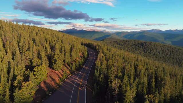 Cinematic aerial drone sunrise morning Subaru driving Denver Mount Evans 14er Chicago lakes front range foothills Rocky Mountains i70 Idaho Springs Evergreen Squaw pass Echo Mountain forward follow