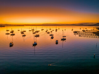 Winter sunrise with clear skies and boats on the water