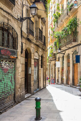 Typical narrow street in the Gothic quarter of Barcelona, Spain