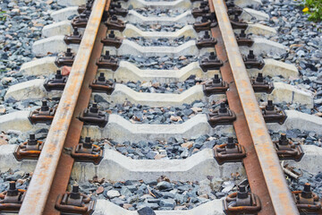 Photo of iron rails and concrete sleepers. Gravel