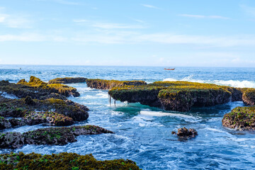 Sawarna beach,west Java,Indonesia, beautiful beach with coral reefs dotted with greenery 