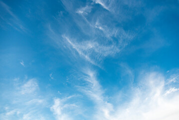 Blue sky with patches of floating clouds.