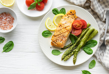 Baked Delicious salmon, green asparagus on  plate