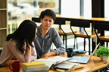 Caring asian man consoling his female friend. Friendship, support and youth lifestyle concept