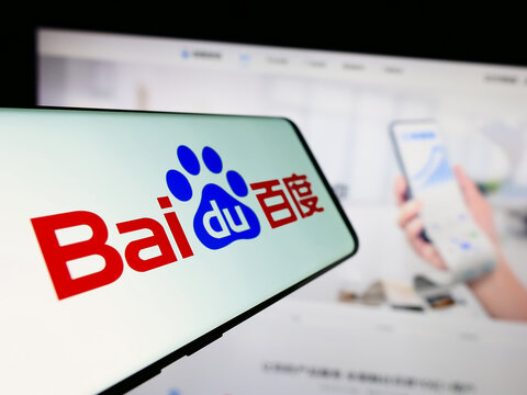 Stuttgart, Germany - 08-15-2023: Mobile phone with logo of Chinese technology company Baidu Inc. on screen in front of business website. Focus on center-left of phone display.