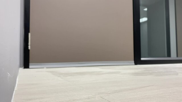 Door stopper for noice reduction low angle view open and close brown door indoor 